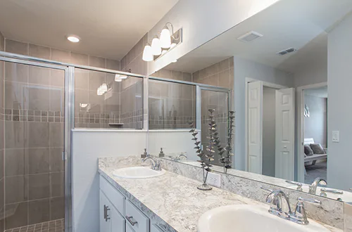 Vanity lighting in owner's bath of Highland Homes' Serendipity model home in Winter Haven, FL
