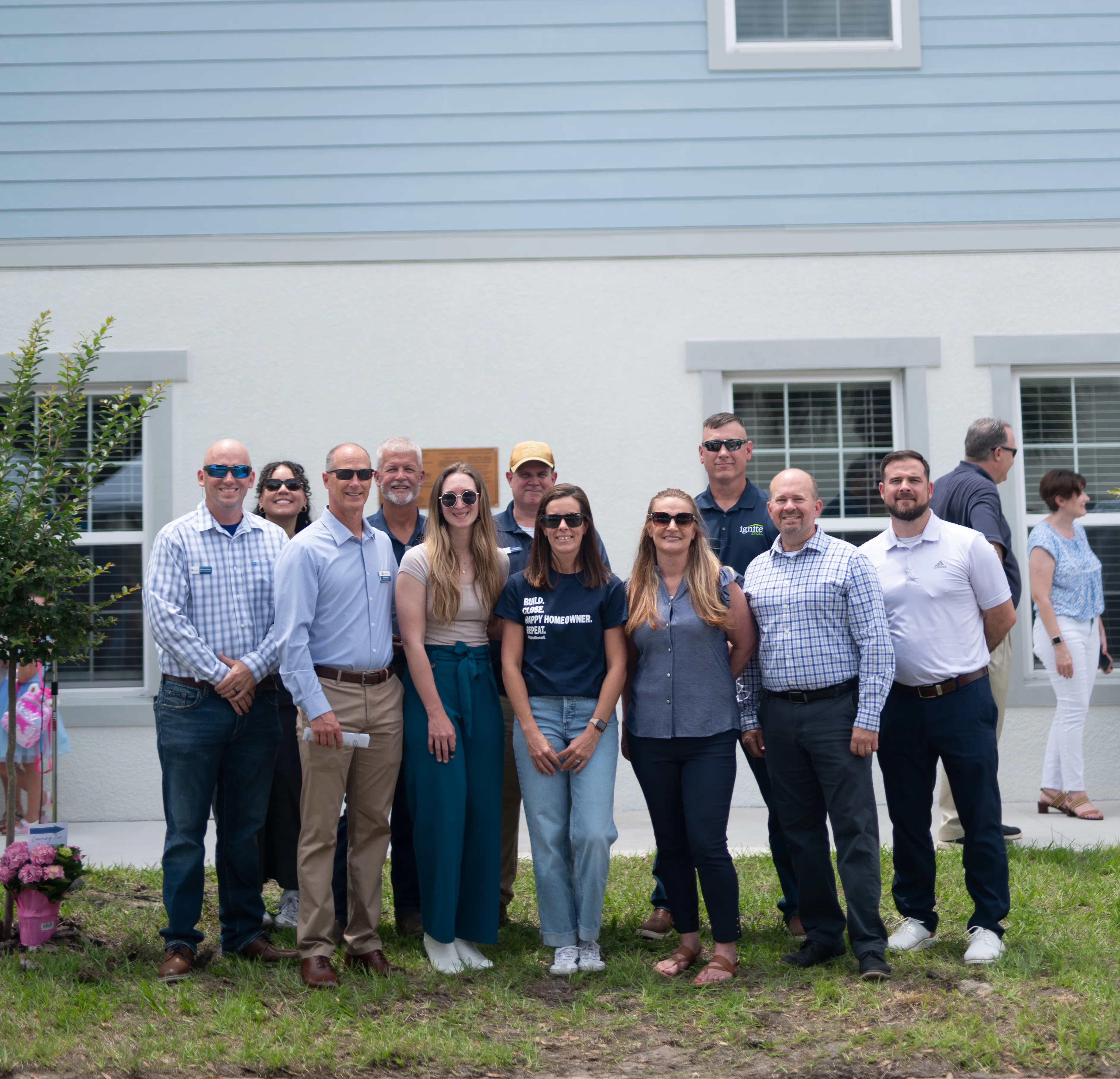 Highland Homes team members celebrate at the Lighthouse Ministries Next Step Housing ribbon cutting ceremony on May 6, 2025, in Lakeland, FL 
