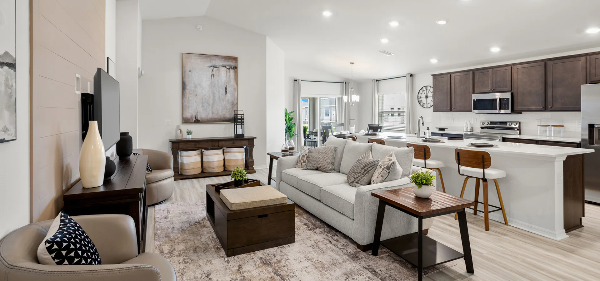 Sunny, open living area with wood finishes in the Parker by Highland Homes in St. Cloud, FL