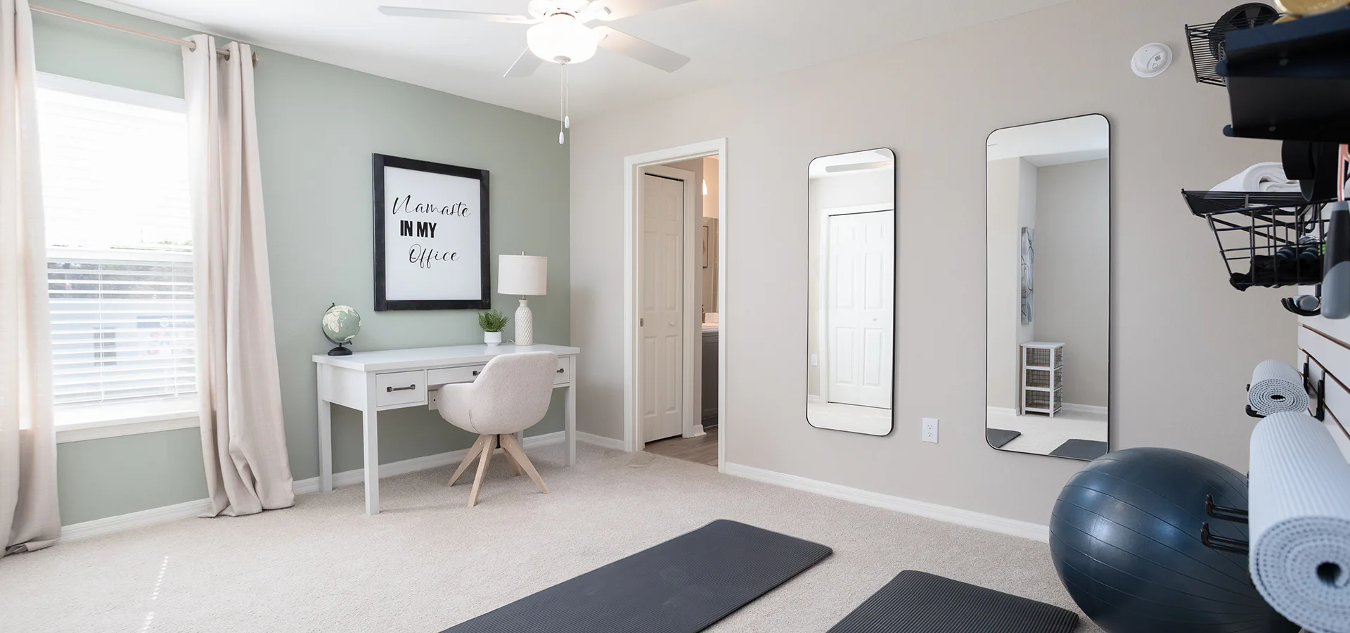 Combo yoga room and office with Namaste sign