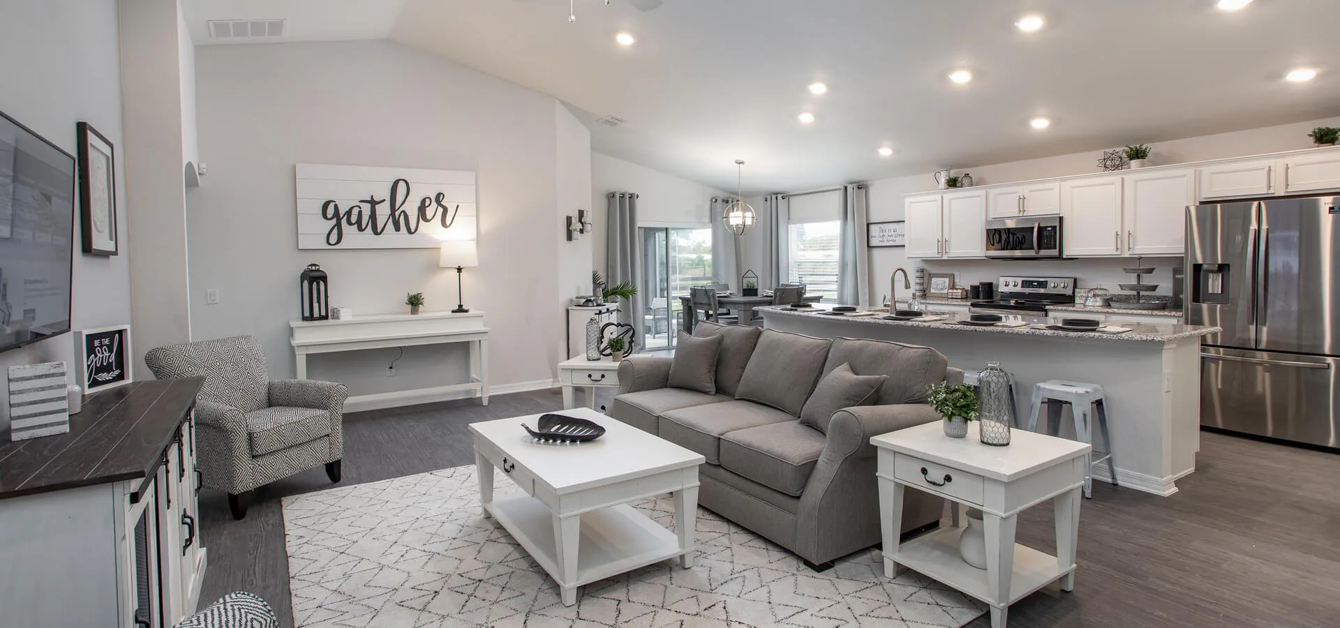 Open layout with gathering area, eat-in kitchen, and dining cafe
