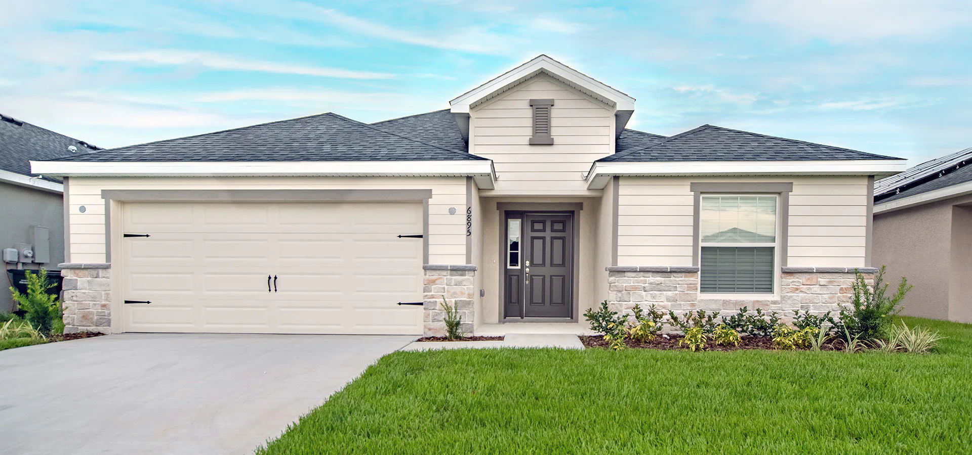 Exterior of the Serendipity by Highland Homes featuring siding, stone accents, and architectural shingles