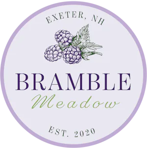 bramble meadow logo with purple circle and blackberries